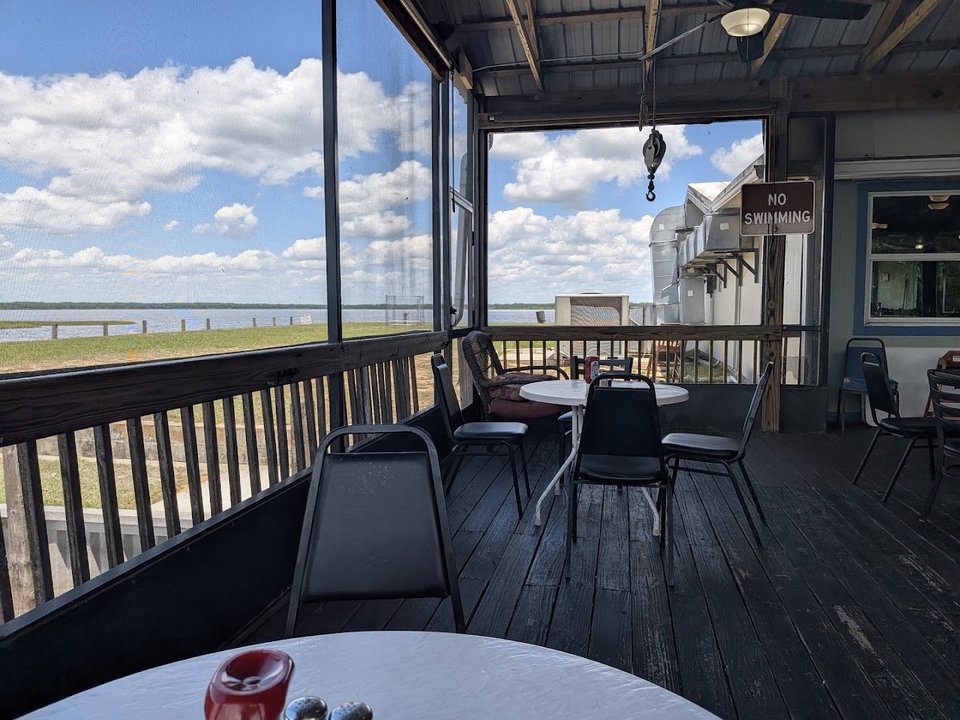 Outdoor dining beside the water.
