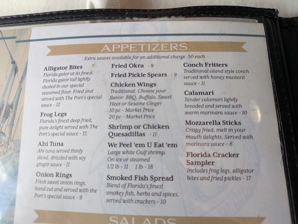 Printed menu showing seafood and hand-helds.